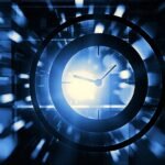 Time abstract clock face with blue motion background.