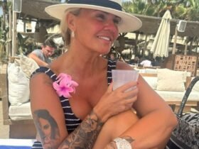 Kerry Katona shows off a huge €24,000 Rolex as she strips down to a bikini to sunbathe on holiday