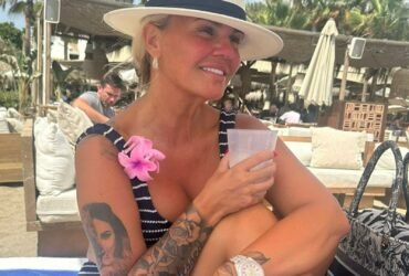 Kerry Katona shows off a huge €24,000 Rolex as she strips down to a bikini to sunbathe on holiday