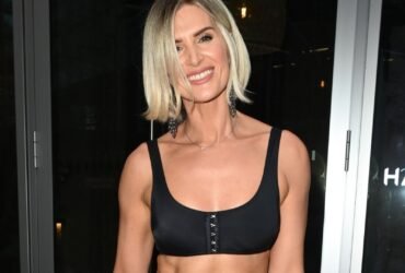 Sarah-Jayne Dunn shows off her rock hard abs in a crop top and sheer mini skirt