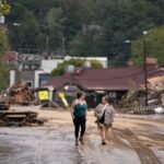 Women walk in the Biltmore Village in the aftermath of Hurricane Helene