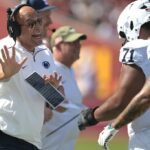 James Franklin walks away from the media after being asked about a rape case