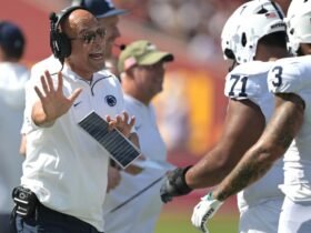 James Franklin walks away from the media after being asked about a rape case