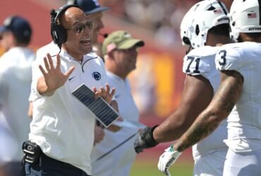 James Franklin walks away from the media after being asked about a rape case