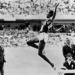 October 18, American shatters long jump world record by nearly two feet