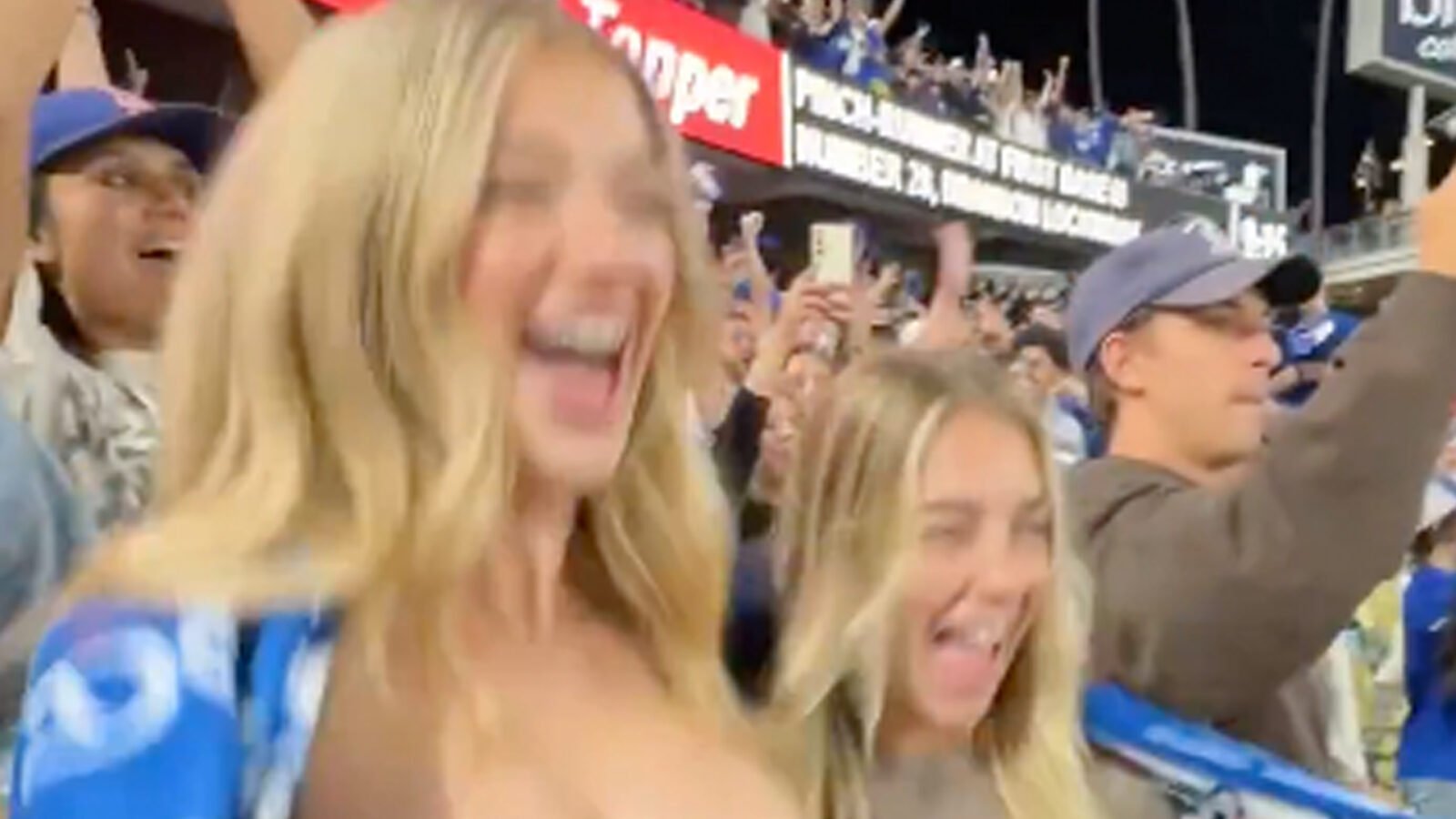 Shocking moment when women flash their breasts in the crowd at a Major League Baseball game in a moment of madness