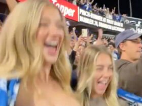 Shocking moment when women flash their breasts in the crowd at a Major League Baseball game in a moment of madness