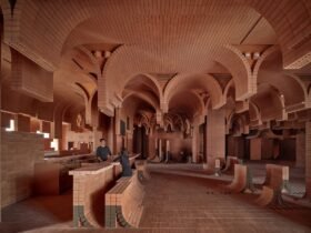 the interior of a cinema lobby made in a contemporary style with curved brickwork