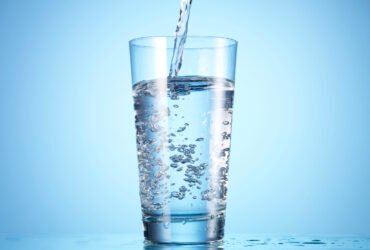 water being poured into a clear glass