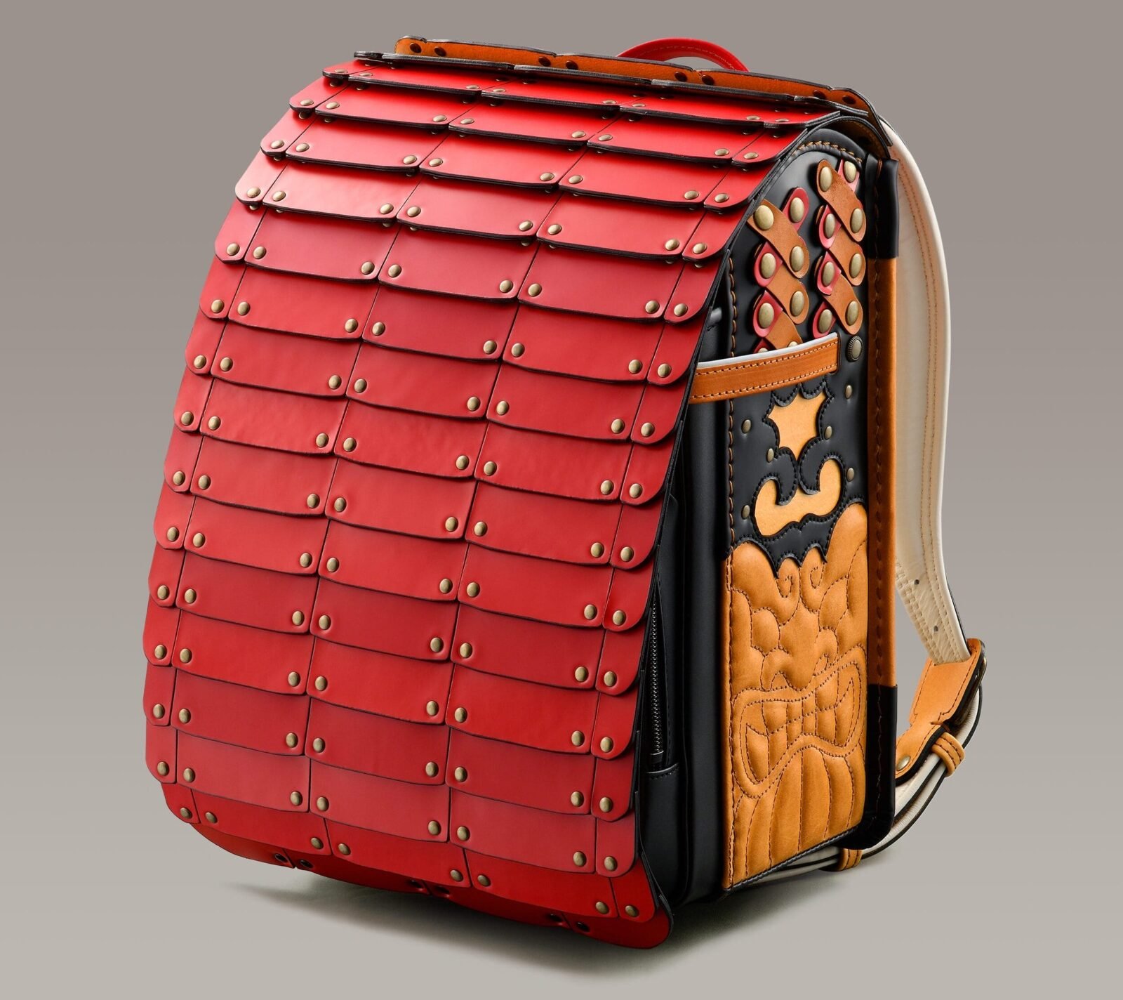 a backpack made from small strips of leather and brads to resemble samurai armor