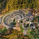 an aerial view of an elaborate hillside garden and landscape design inspired by the curling forms of Vincent van Gogh