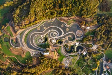 an aerial view of an elaborate hillside garden and landscape design inspired by the curling forms of Vincent van Gogh