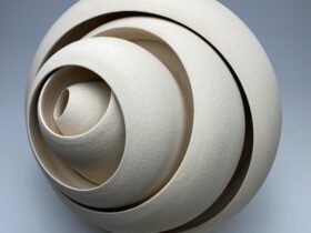 a ceramic sculpture with concentric forms that twist and well outward