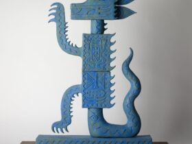 an abstract ceramic sculpture suggesting a dragon in profile, painted blue