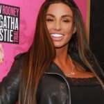 Katie Price takes off her bra in her kitchen to show off her 17th boob job after weight loss