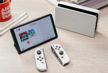 Nintendo Switch OLED in white on a desk