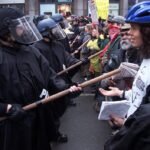 November 30, WTO protesters and police clash in Seattle