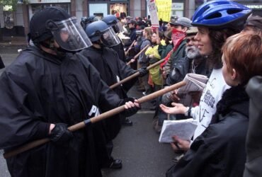 November 30, WTO protesters and police clash in Seattle