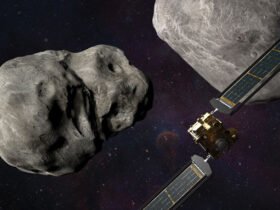 Illustration of NASA DART spacecraft shoving the distant asteroid moonlet Dimorphos off course in 2022.