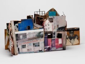 a sculpture of an abstract house made from ceramics, found objects, photographs, and other mixed media