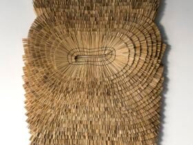 an abstract wall hanging made from rice straw