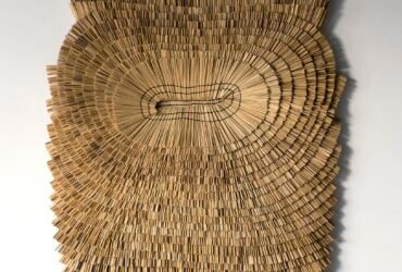 an abstract wall hanging made from rice straw