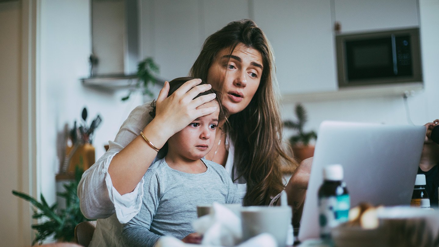 A mother holds her child