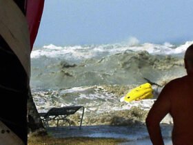 A tsunami approaches people on a coastline in Malaysia on December 26, 2004.