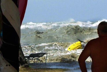 A tsunami approaches people on a coastline in Malaysia on December 26, 2004.