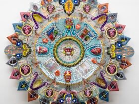 an abstract glass sculpture in the form of an Aztec calendar with numerous mixed-media details and patterns