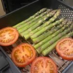 Two layers of vegetables ready to go into the air fryer