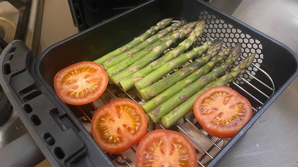 Two layers of vegetables ready to go into the air fryer