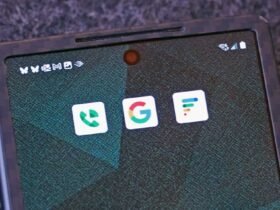 android phone with app logos Google, Google Voice, Google Fi