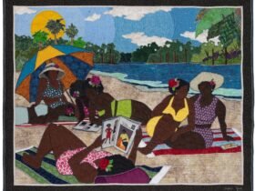 a quilted figurative portrait of a group of Black women lounging in the sun on a sandy riverbank