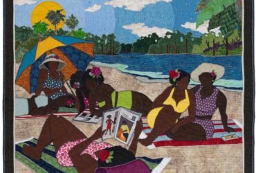 a quilted figurative portrait of a group of Black women lounging in the sun on a sandy riverbank