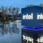 Intel Headquarters Robert Noyce Building in Santa Clara, California at night with Intel sign lit up.