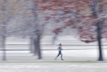 Light snow in mountains, wind over plains