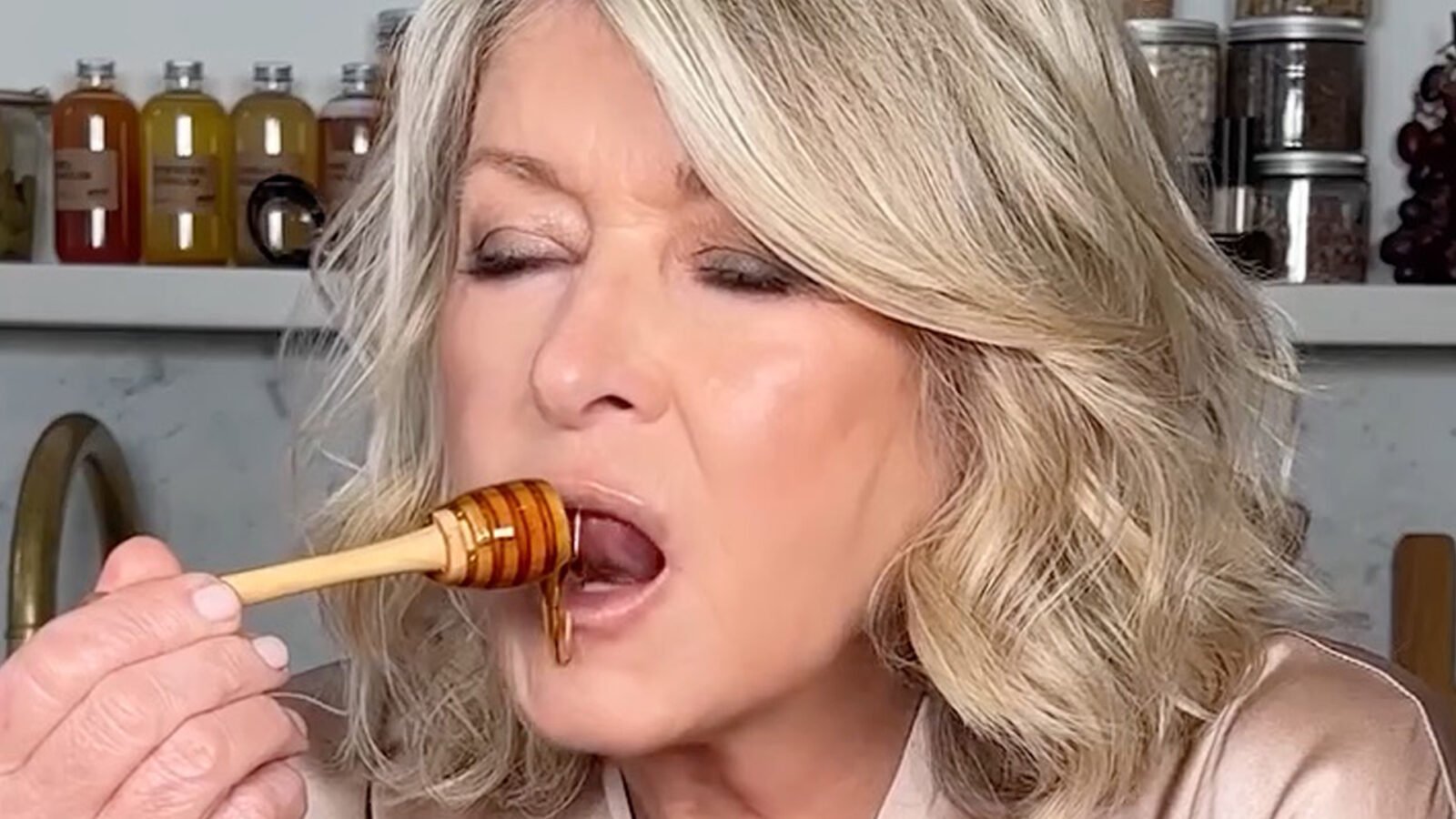 Martha Stewart, 83, sucks on a strawberry and licks honey in the thirst trap Mac advertisement - and fans call it 'Genius and Unhinged'