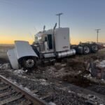 Semitruck driver injured in east Aurora train crash