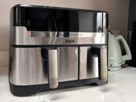 The air fryer on a kitchen counter, with a kettle in the background