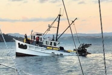 Two rescued as fishing boat sinks