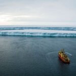 A boat heads toward Thwaits Glacier in Antarctica.