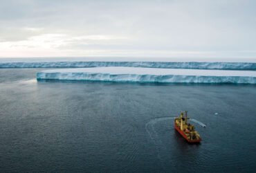 A boat heads toward Thwaits Glacier in Antarctica.