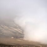 View of fog at the Atacama desert in Iquique, some 2000 km north of Santiago, on April 19, 2016. Catholic University of Chile researchers' challenge is to implement a fog collection system -which uses large pieces of vertical canvas to make the fog condense into droplets- in small communities which don't have drinkable water in Atacama desert. / AFP / MARTIN BERNETTI (Photo credit should read MARTIN BERNETTI/AFP via Getty Images)