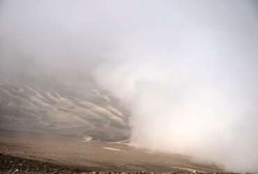 View of fog at the Atacama desert in Iquique, some 2000 km north of Santiago, on April 19, 2016. Catholic University of Chile researchers' challenge is to implement a fog collection system -which uses large pieces of vertical canvas to make the fog condense into droplets- in small communities which don't have drinkable water in Atacama desert. / AFP / MARTIN BERNETTI (Photo credit should read MARTIN BERNETTI/AFP via Getty Images)