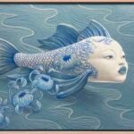 a combination woodcut and acrylic painting of a blue fish with the face of a human woman, with blue flowers falling from its back as it floats atop the surface of the water