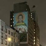 Solid "Free Luigi" image projected on the Manhattan building