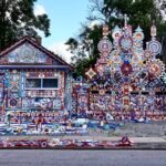 an extravagantly decorated house in New York, home to Prophet Isaiah Robertson, who turned the entire structure into an artwork in myriad colors with large pinwheel-like sculptures and paintings