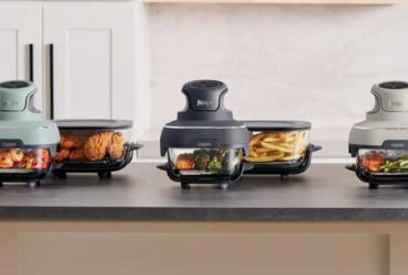 The portable air fryer in three different colours on a counter