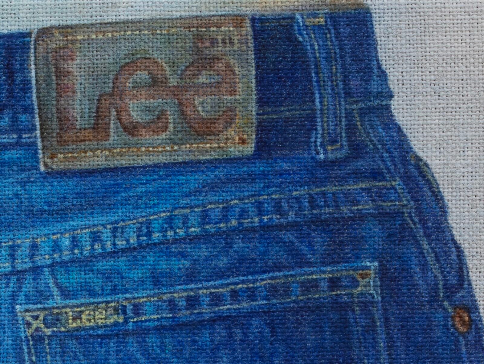 a detail of a hyperrealistic painting on burlap of Lee blue jeans